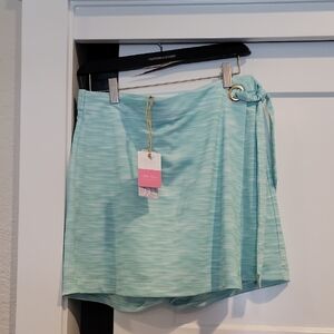 NWT SKORT  WOMANS SZ.M UPF 50+. TENNIS SPORTY